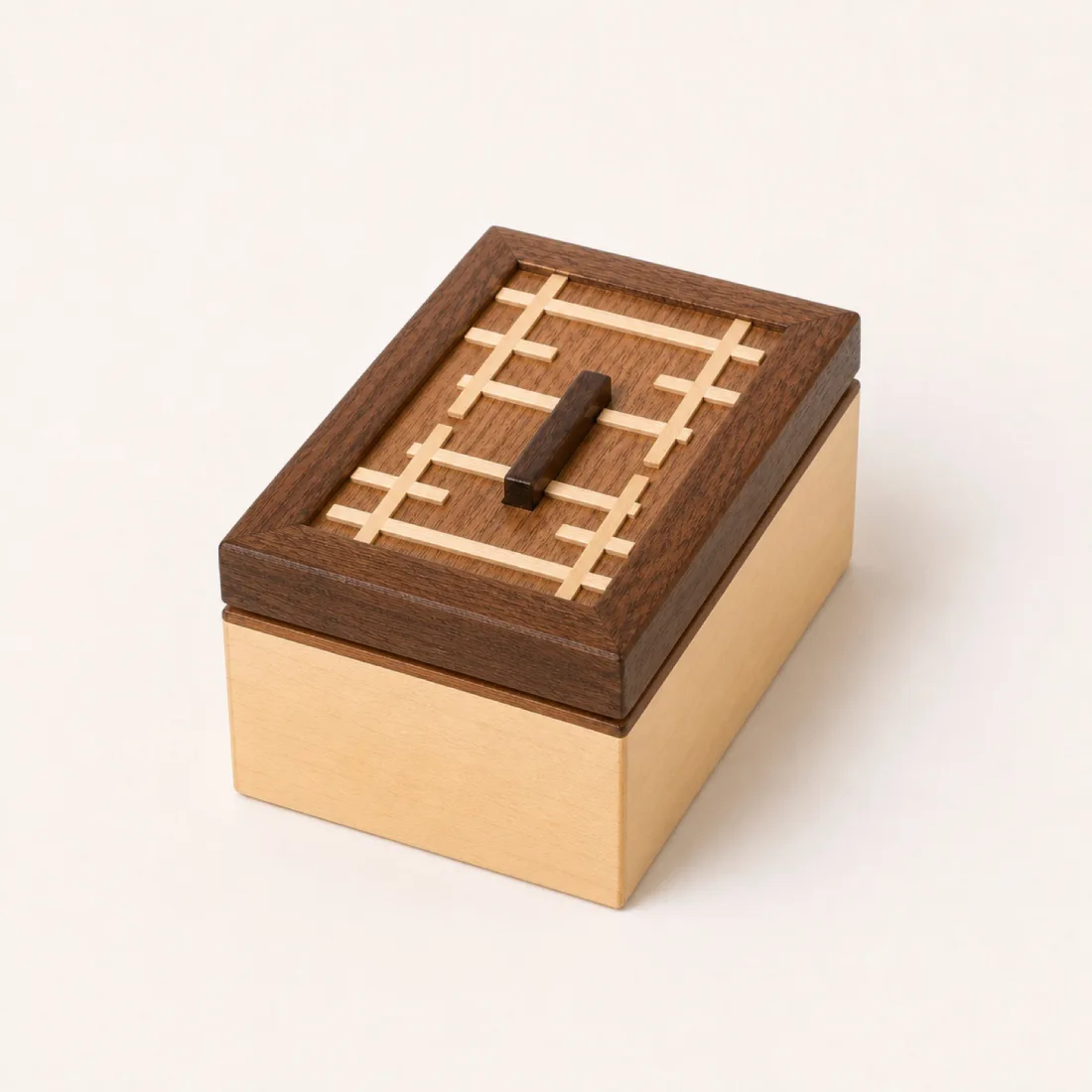 Palm-sized wenge box with a boxwood kumiko cross set flush into the lid