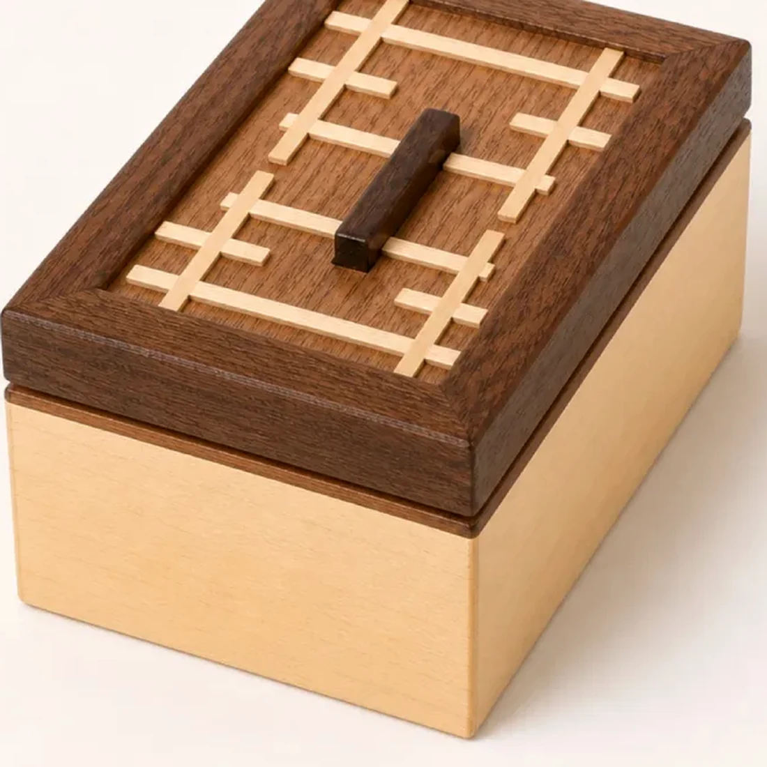 Macro of the boxwood kumiko cross set flush into the lid