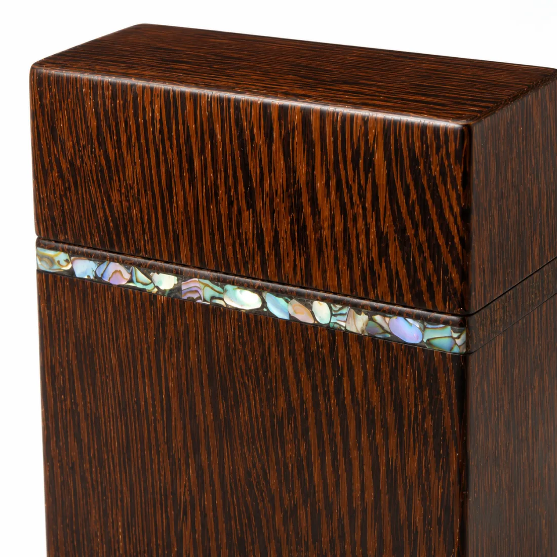 The dark card box holding a deck of cards