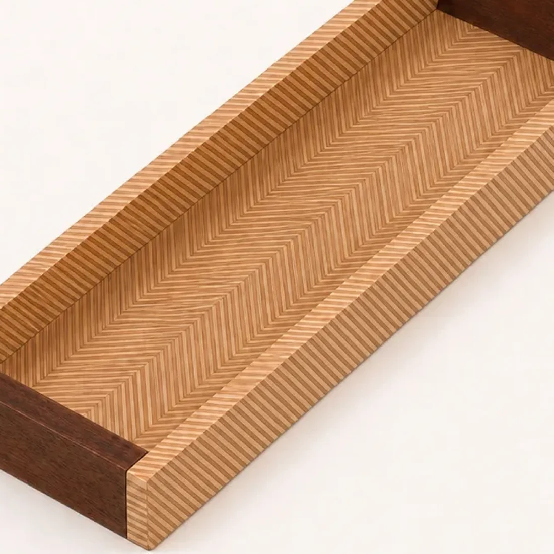 Close detail of the herringbone chevron-inlay floor