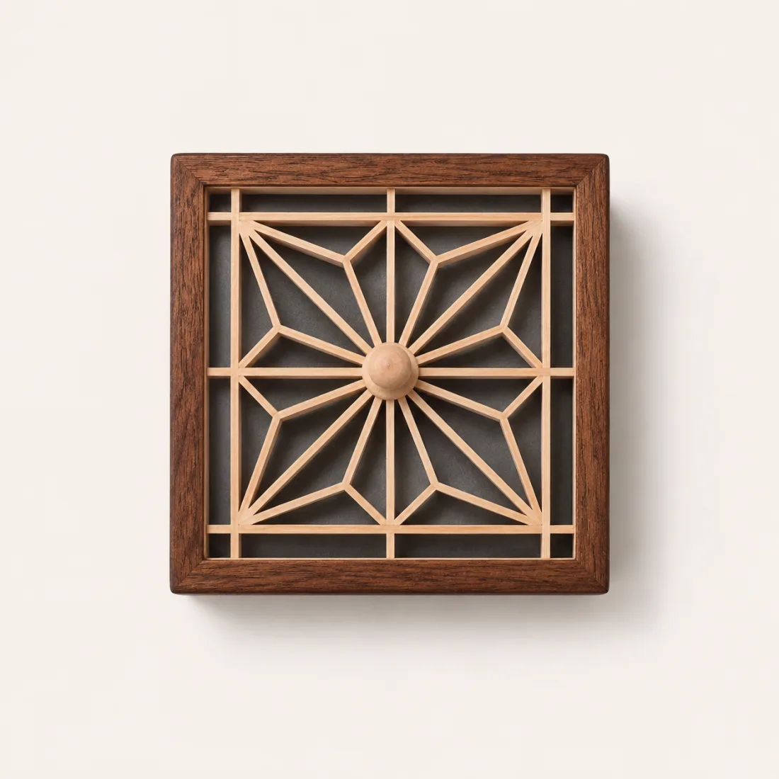 Shallow square wooden box with a removable radial lattice lid and round centre detail