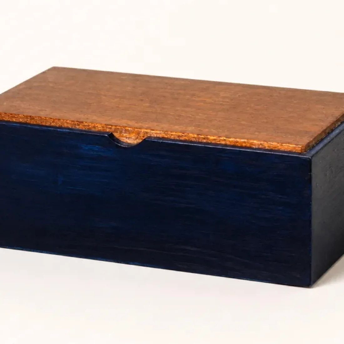 Close detail of the cherry lid against the indigo-dyed base