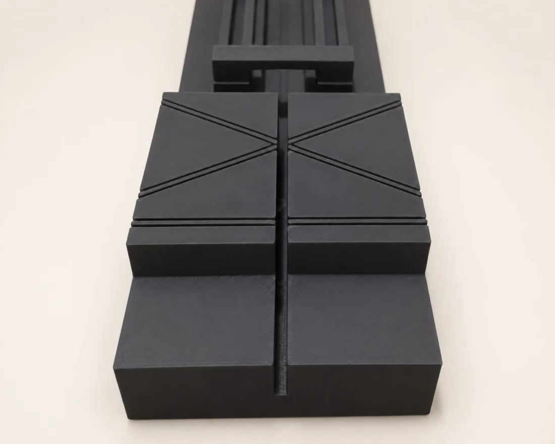 Close detail of the cutting station kerf and angled reference guides